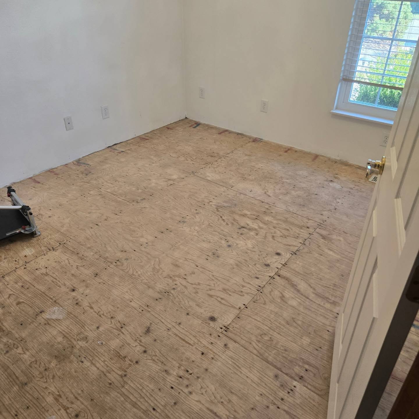 Bedroom subfloor before LVP flooring installation in Valmeyer, Illinois